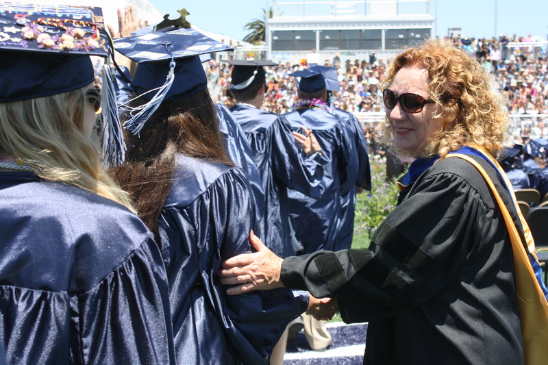 Assistant principal Jeanne Jones guides students to their seats. jones