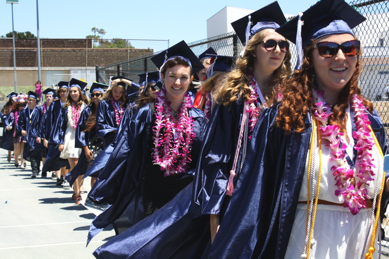 Students leave the tennis courts to begin walking to their seats. josie