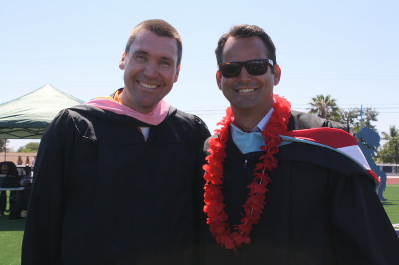 Band teacher Jeremy Wuertz and Principal Timothy Hornig pose after graduation. weurtz-hornig