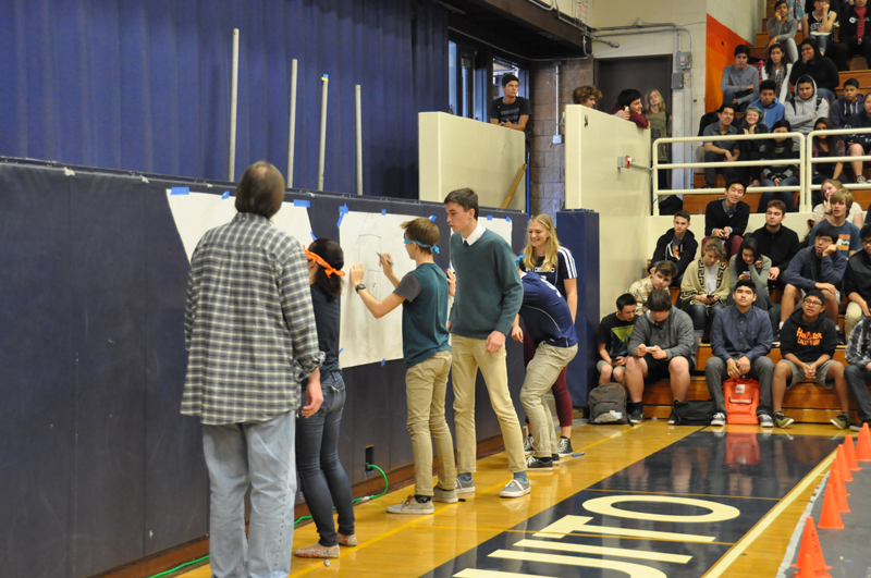 Students and teachers participate in a relay race 11
