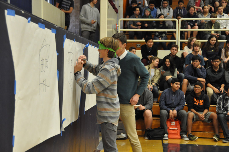 Students and teachers participate in a relay race 13
