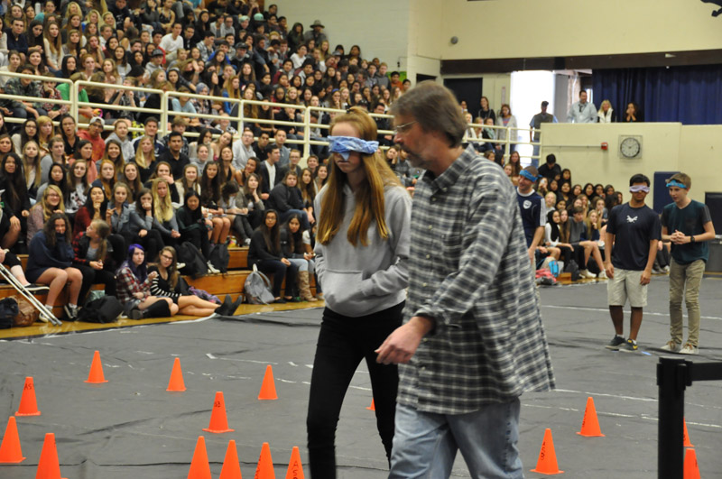 Students and teachers participate in a relay race 14