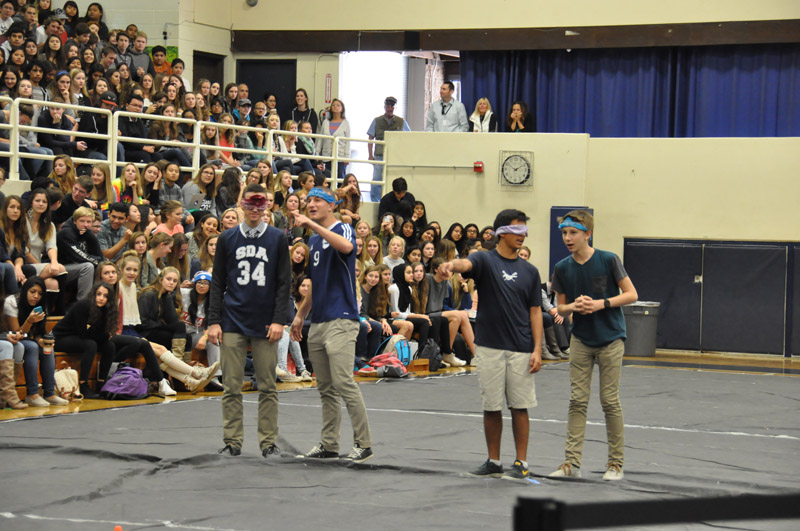 Students and teachers participate in a relay race 15