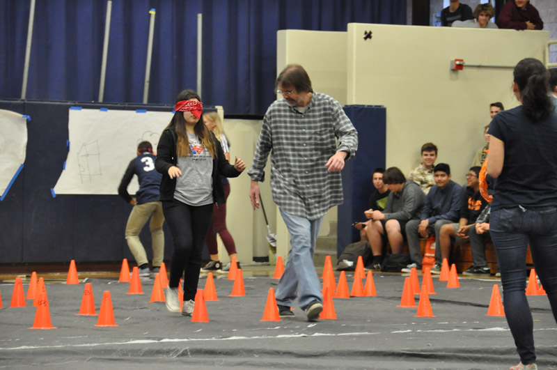 Students and teachers participate in a relay race 16