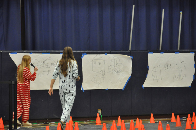 Students and teachers participate in a relay race 17
