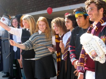 Seniors+George+Stimson%2C+Trevor+Wright%2C+Reem+Jubran%2C+Micah+Stimson%2C+Elise+Courtois%2C+and+Lindsey+Marshall+raise+their+wands+in+celebration+of+Harry+Potter+Day.
