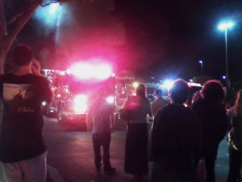 Locals+gather+to+watch+as+the+firefighters+attempt+to+extinguish+the+fire+at+the+Encinitas+McDonalds.