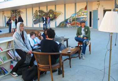 Senior Alison Ryall, junior Julian Dennis, sophmores Tacy Manis, Laura Briedenthal and Cassidy Mayeda, and art teacher Jeremy Wright sit in their club's latest creation. 
