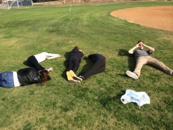 Students pose in "SDA" formation for Homeroom Olympic's scavenger hunt.