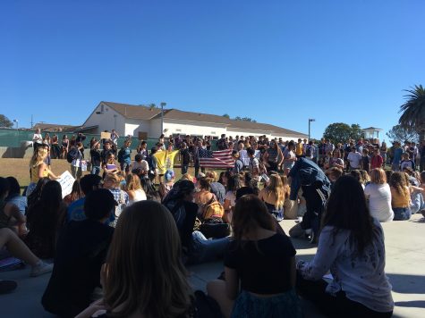 Students gather in front of the Performing Arts Center to protest Trump.