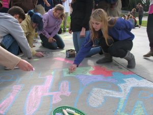 Students participate in the Chalk Art Homeroom Olympics event in 2014.
