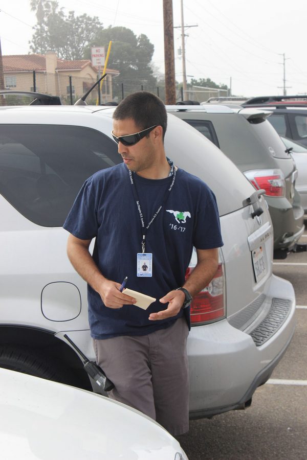 Anthony+Valencia+patrols+the+student+parking+lot.