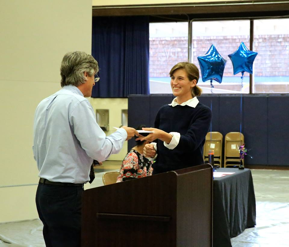 Senior Gabriela Navarro receives a scholarship award.