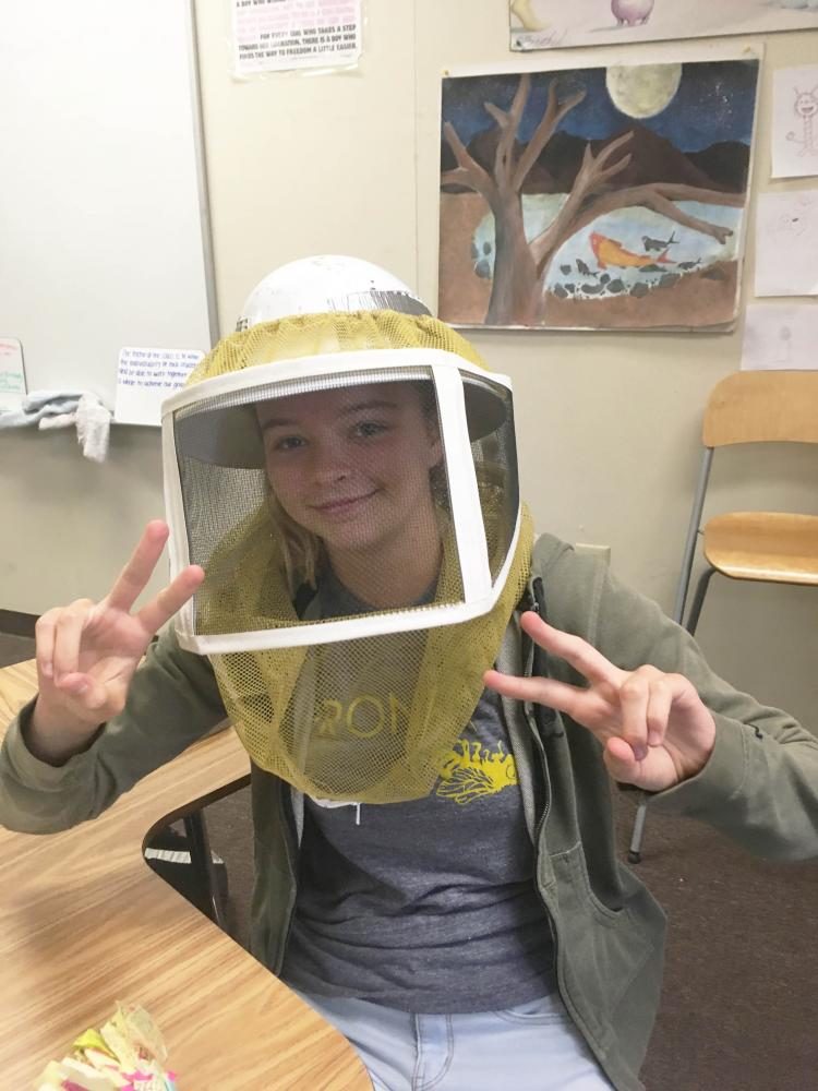 Madeline Larosche in her beekeeping gear.