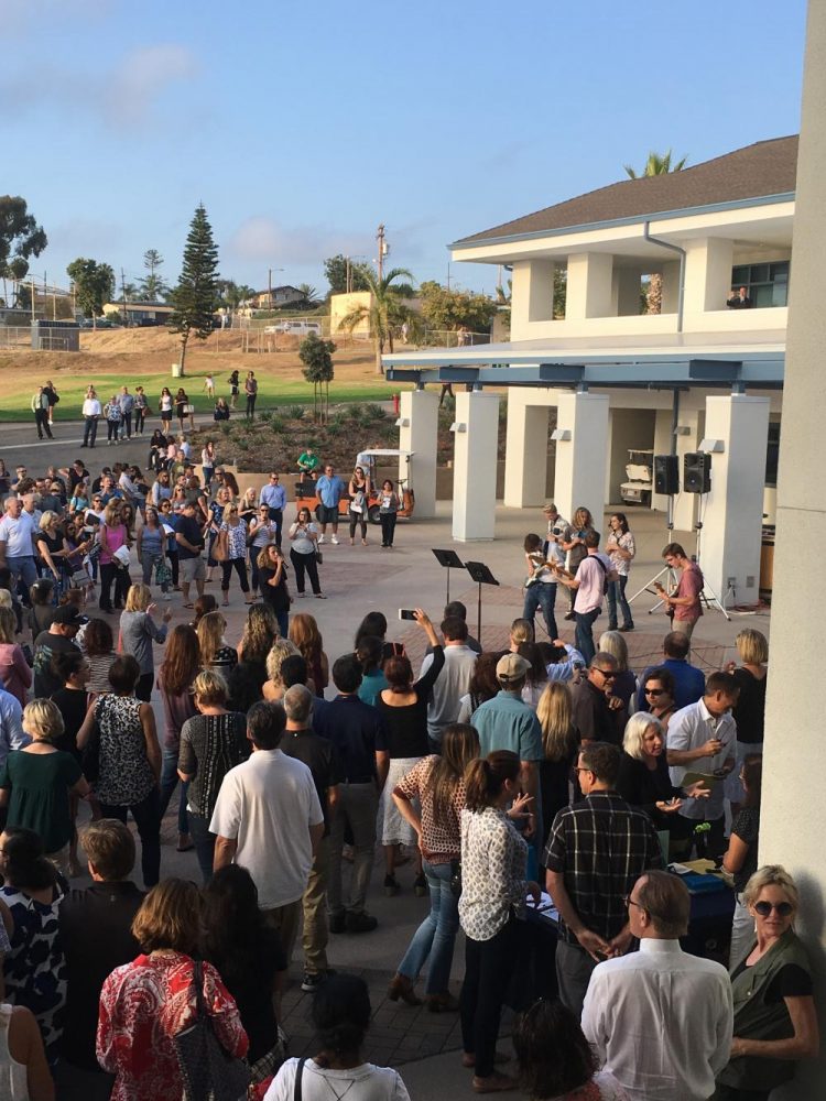 Parents gather in the new building courtyard during Back to School Night.