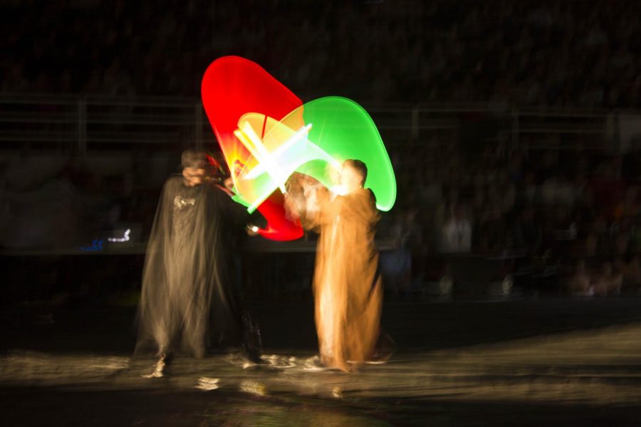 Junior Caeden Schlosser and Principal Adam Camacho duel at the homecoming assembly.