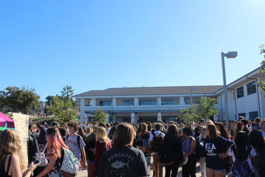 Students crowd around different booths.