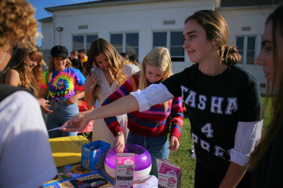 Students at Tasha Gardiners campaign booth sell cotton candy.