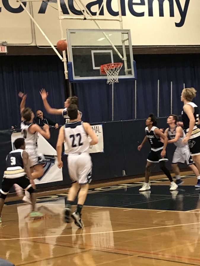 SDA boys basketball plays hard against LCC.