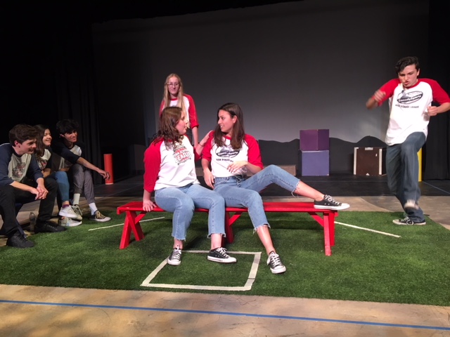 Thespians Ava Lilie and Olivia Olander look to one another as they take center stage, trying to beat the Comedy Sportz team at their own game. 