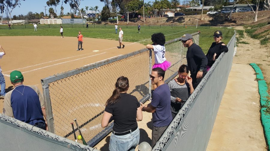 Some teachers waiting in the dugout for their chance at victory. 