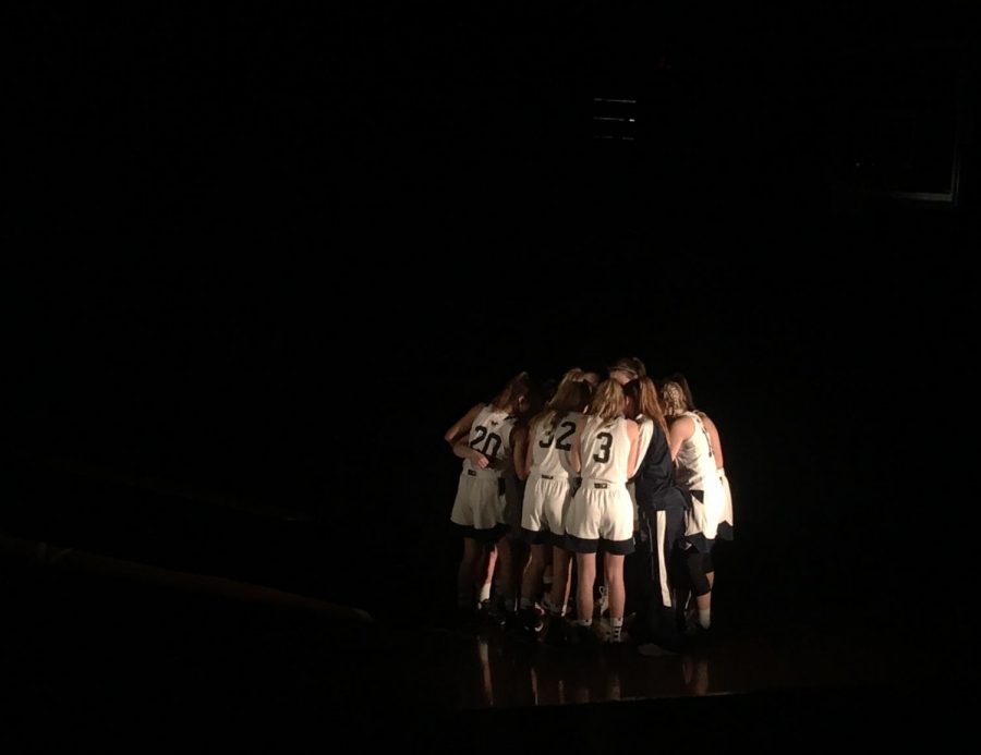 The San Dieguito team huddles together before the start of the big game.