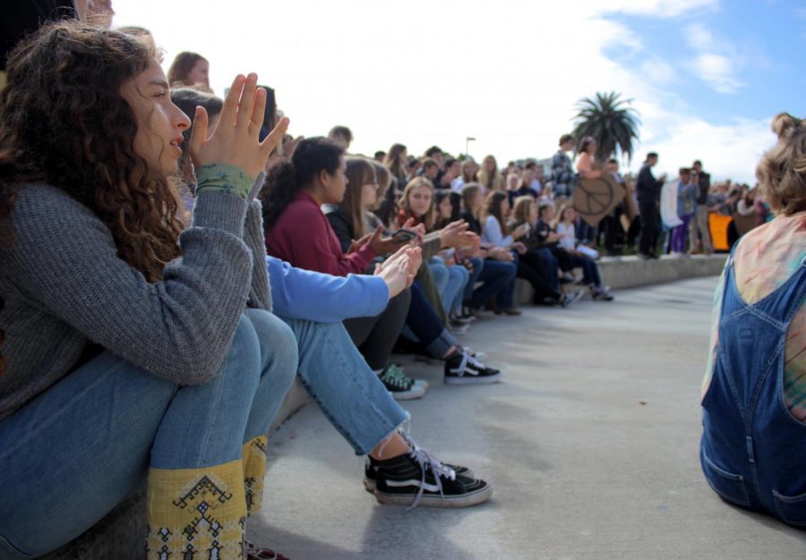 Students applaud after a speech.