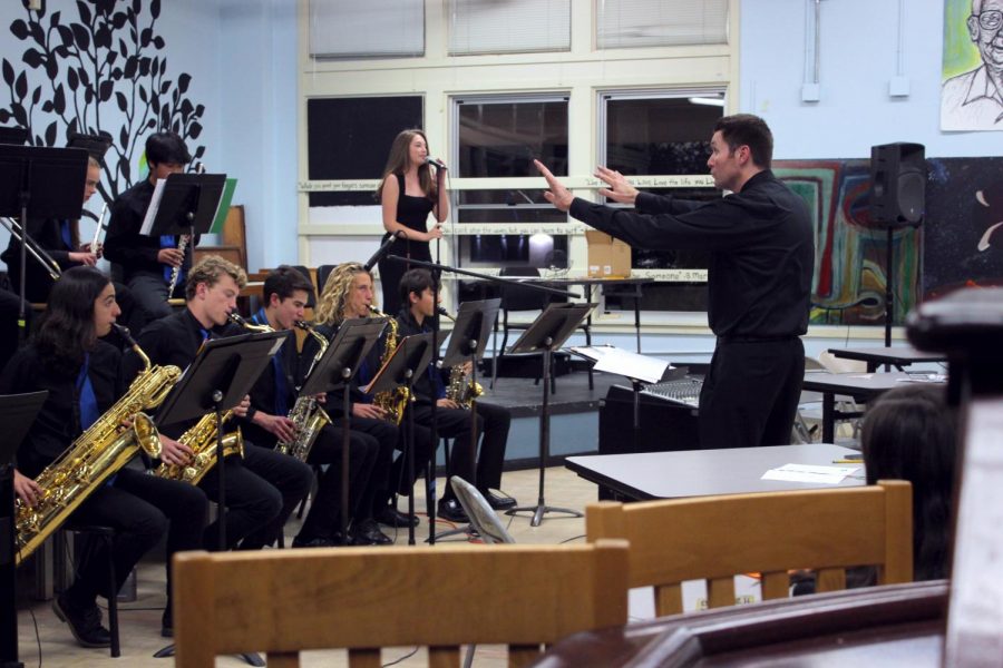 Music+teacher+Jeremy+Wuertz+conducts+the+SDA+Jazz+Band%2C+accompanied+by+senior+Jenna+Steinberg.