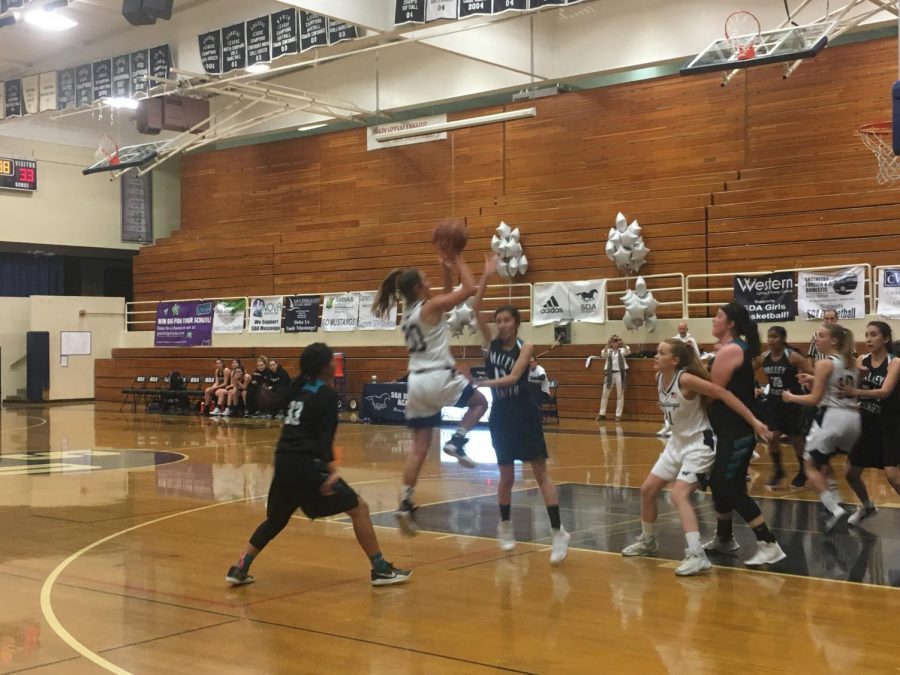 Sophomore Addie Werbelow scores during an earlier game against Valley Center.