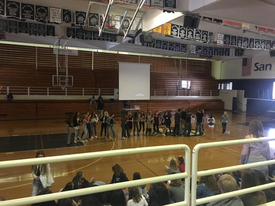 Freshmen dance to the song YMCA in the gym