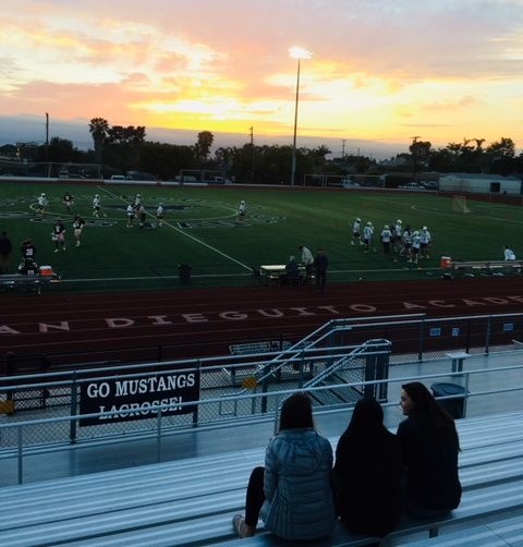 SDA students support the boys lacrosse team in their game.