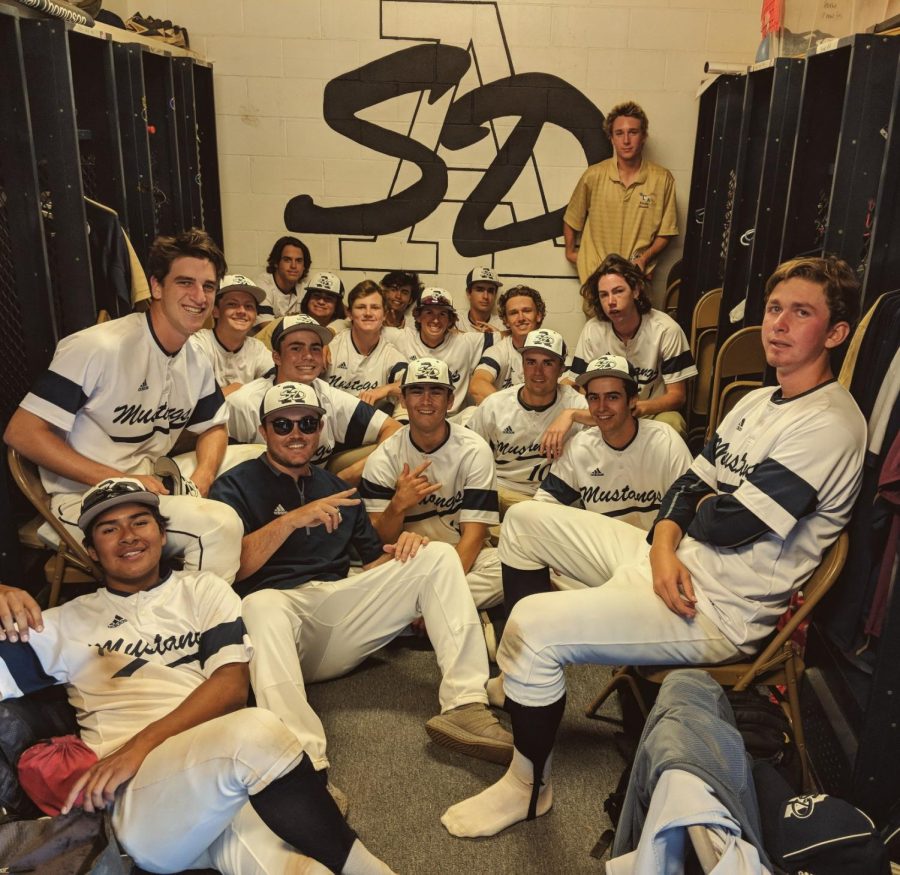 The SDA boys baseball team celebrates after their game.