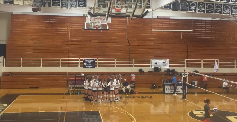 Girls Varsity Volleyball prepares for a match against Vista.