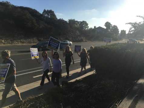 SDFA members walking along the side of the district office.