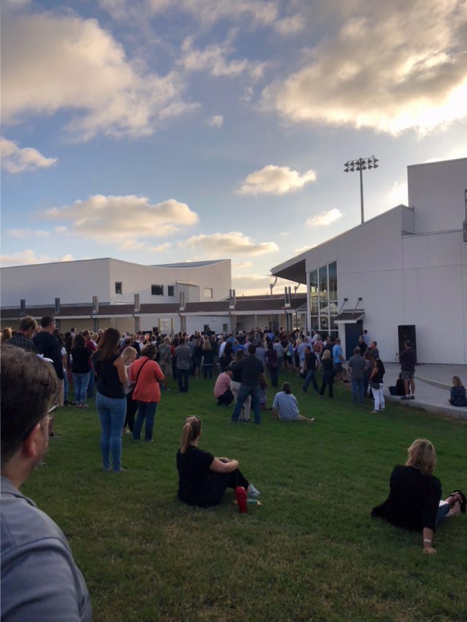 Parents gathering around the PAC-Bell Tower area for back to school night.