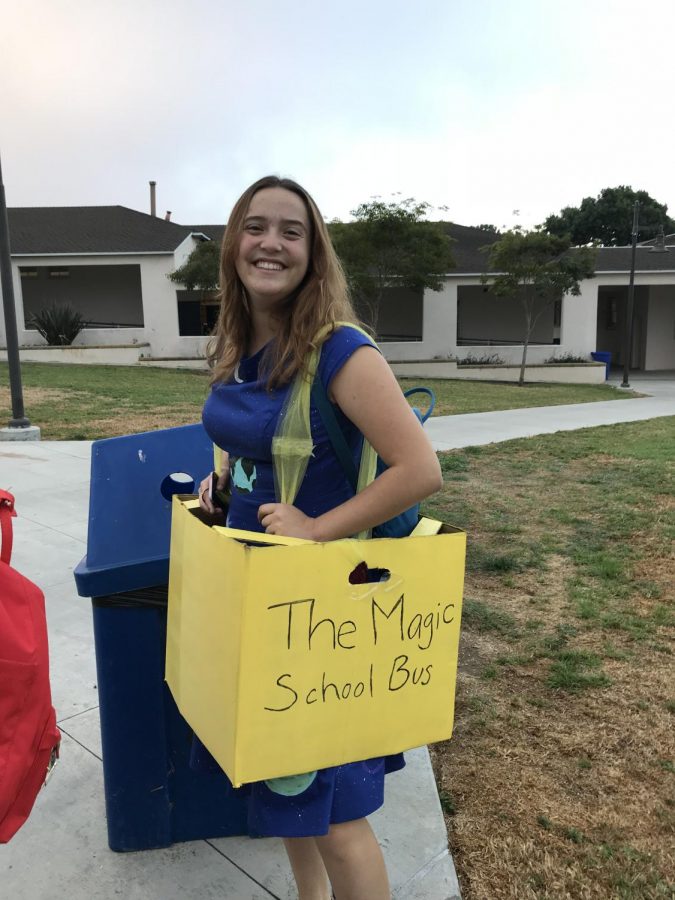 Junior Skylar Masterson dressed as Mrs. Frizzle, including the Magic School Bus.