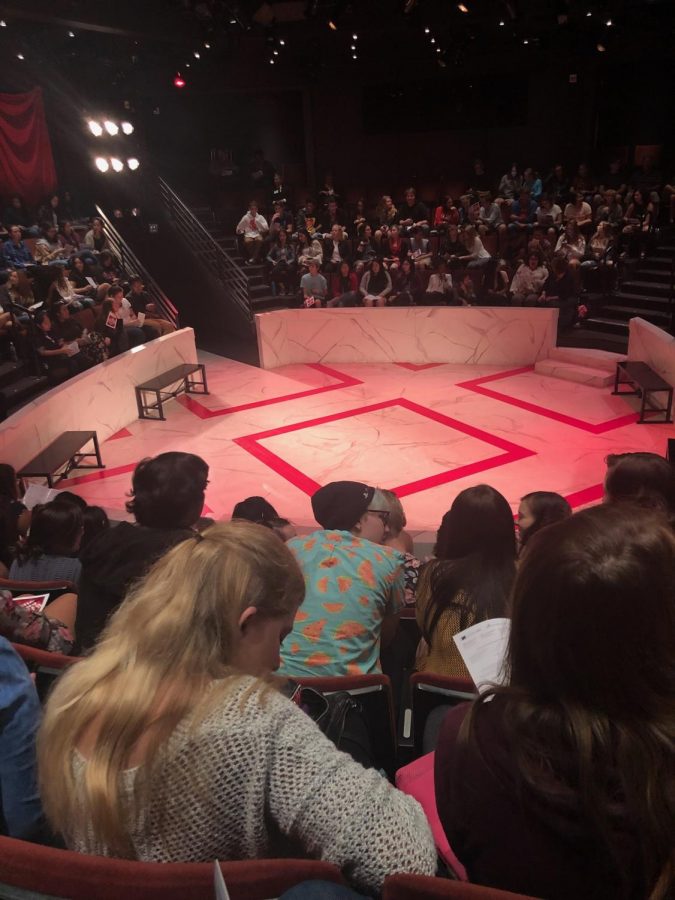 The round at the Old Globe where the show was performed. Note the marble painted floor and red design.