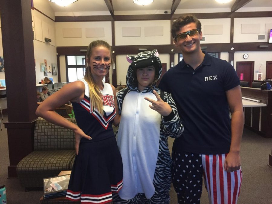 Juniors Belle Benedetto (cheerleader), Katie Eliceiri (zebra), and Brandon Rudman (Rex Kwon Do) dressed up for school!