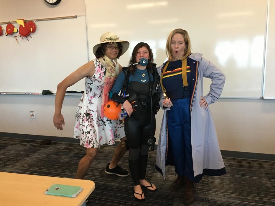 (left to right) Seniors Ben Noon and Jana Roper dressed as a girl and a scuba diver with math teacher Darlene Blanchard dressed as The 13th Doctor.