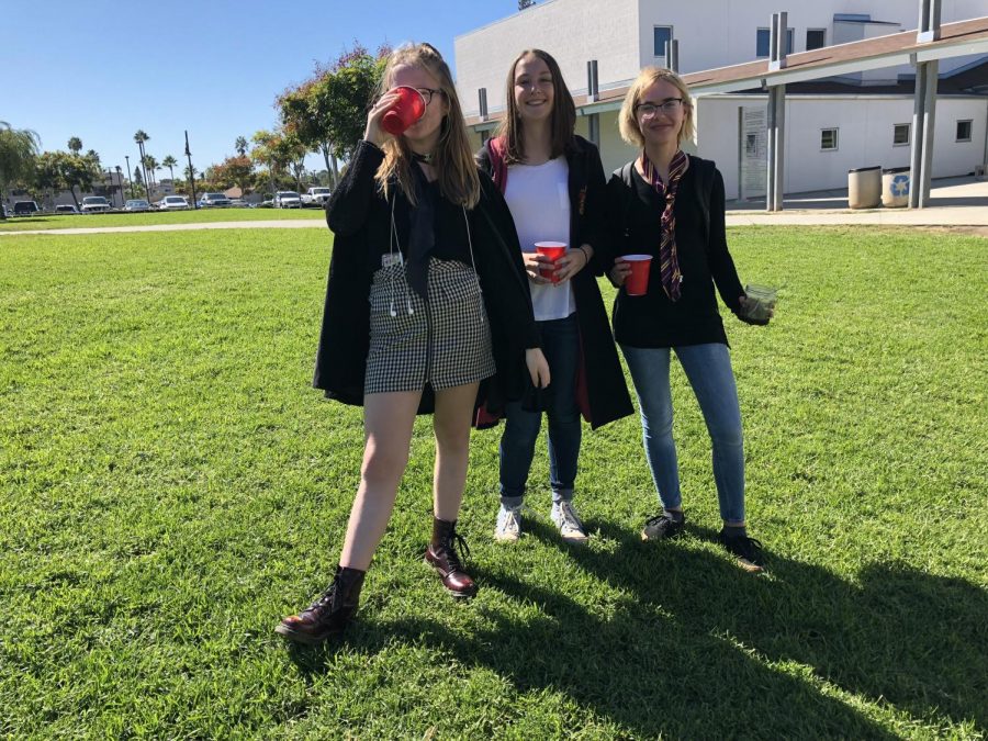 Freshmen Rory Price and Grace McKenzie and sophomore Brenna Sullivan enjoy their "butter beverage."