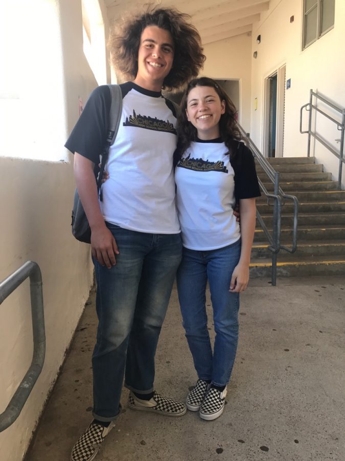 Seniors Dylan Herrera and Eryn Broughton wear matching theatre shirts.