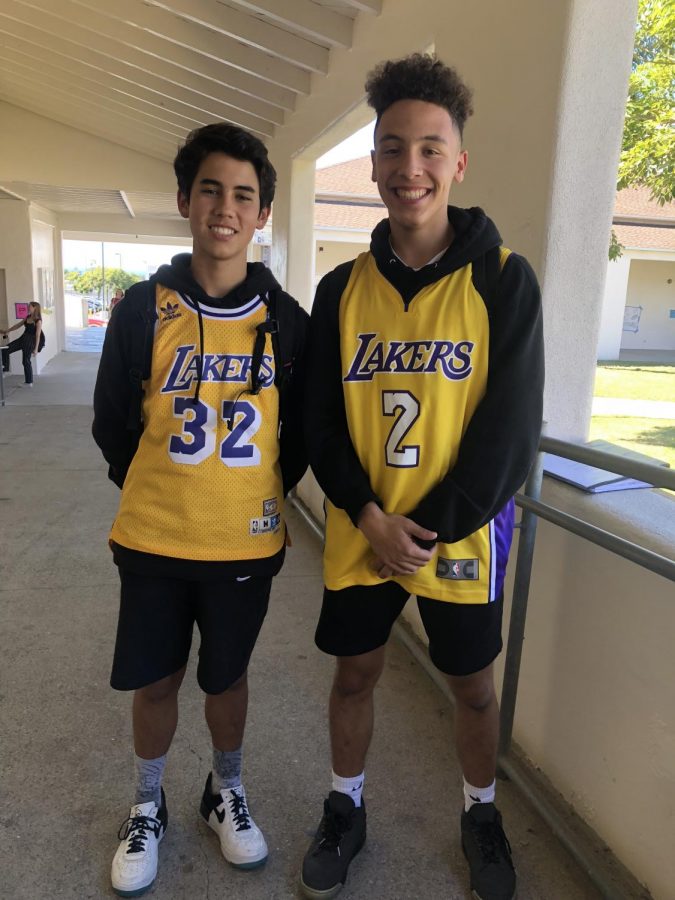 Sophomores Adrian Thierry and Ronan McDonnell sporting Lakers attire for sports day.