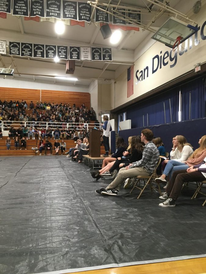 Junior Kalvin Grensted and student body president candidate gives his speech to SDA students with other candidates for different things stand by.