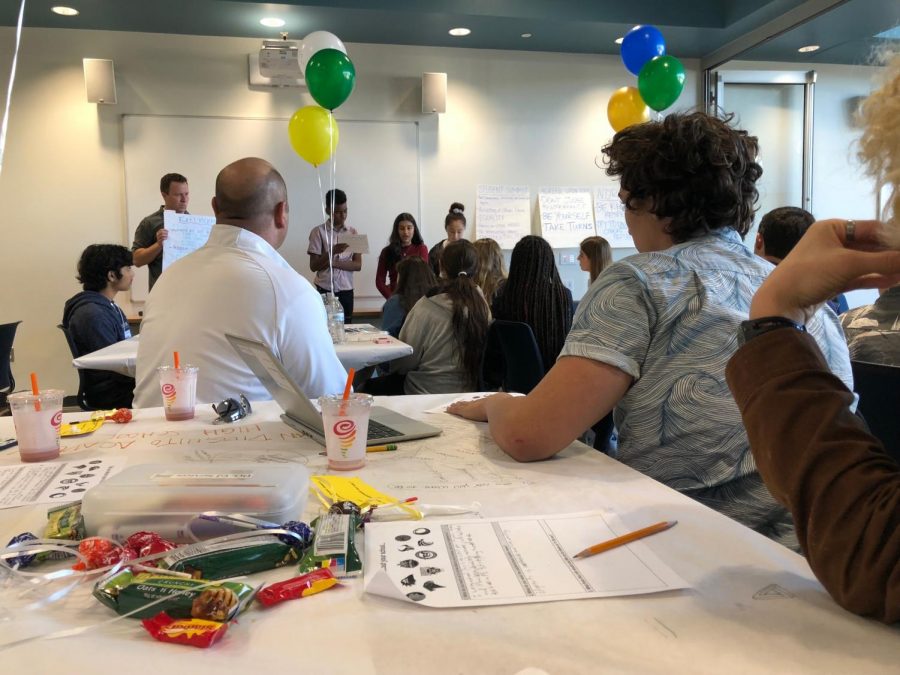 Students from each school sat at tables to collaborate and decide on which issues they wanted to address.