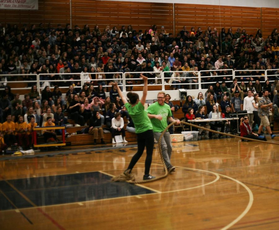 ASL+teacher+Kelly+Baggins+and+English+teacher+Robert+Ross+celebrate+after+they+win+the+teacher+tug-o-war.+