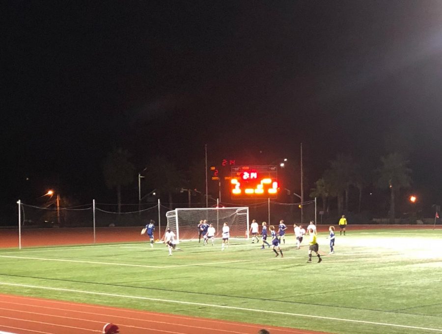 Mustang players try to get a head on the ball after a corner kick is sent into the box. Photo by Alexandra Joelson.