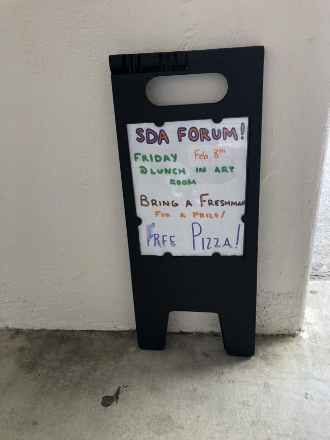 One of many signs posted around campus advertising the forum. 