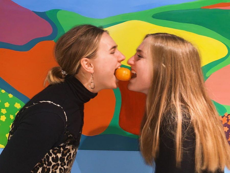 Piper (left) and Emily (right) share a snack.