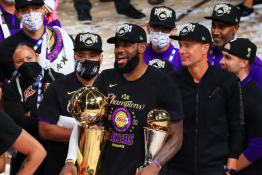 LeBron James celebrates after winning his first championship with the Los Angeles Lakers and fourth NBA Finals total