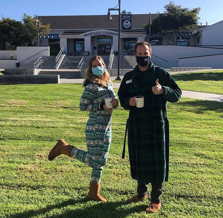 Assistant Principals Katie Bendix and Jeremy Meadows pose in front of The Mustang Commons